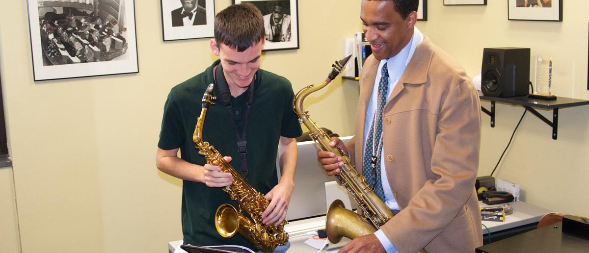 Javon Jackson works with a saxophone student