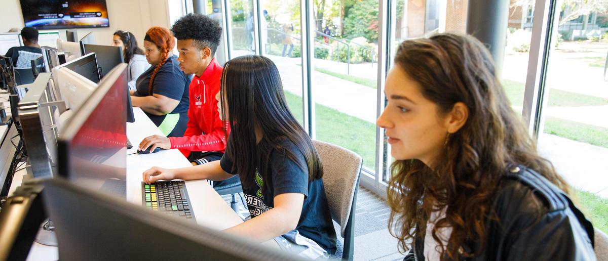 UHart students sitting in a classroom.